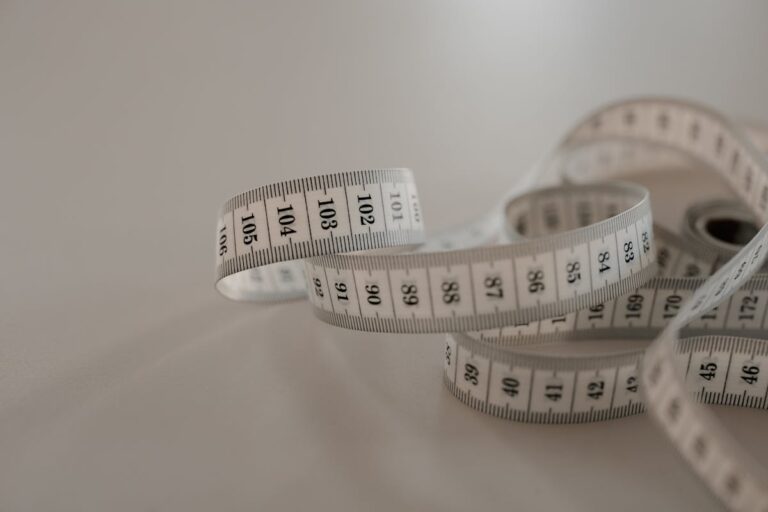 Dog being measured with tape for sweater sizing